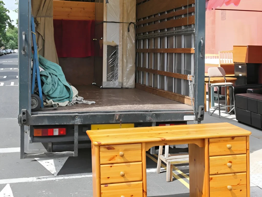 Image showing a moving truck being loaded with furniture.