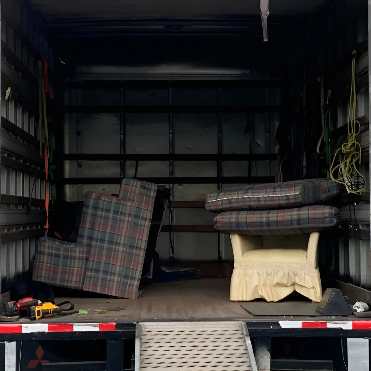 Image of furniture loaded onto a truck for a donation run.
