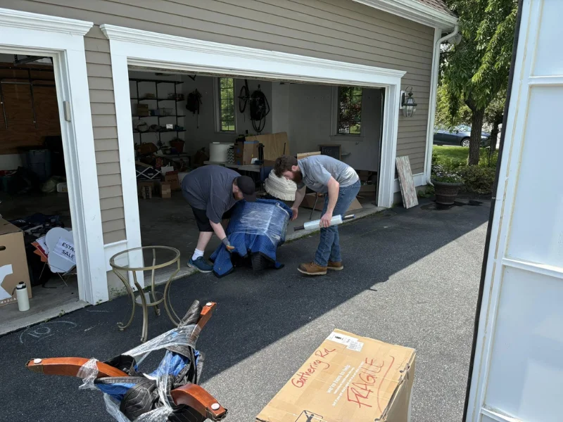 Image of Rubbish Rescue working in the neighborhood, hauling junk.